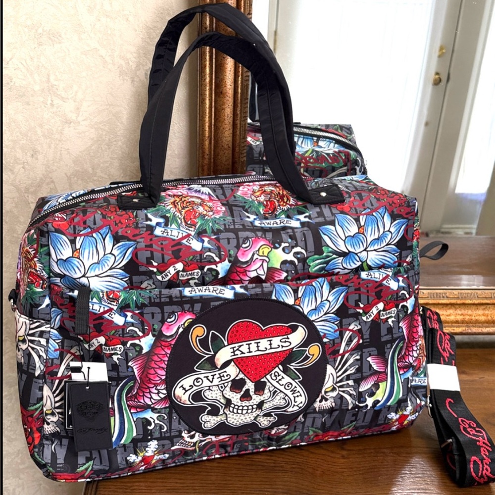 Beautiful Ed Hardy Skull & Floral Duffel Bag. Various pockets and storage